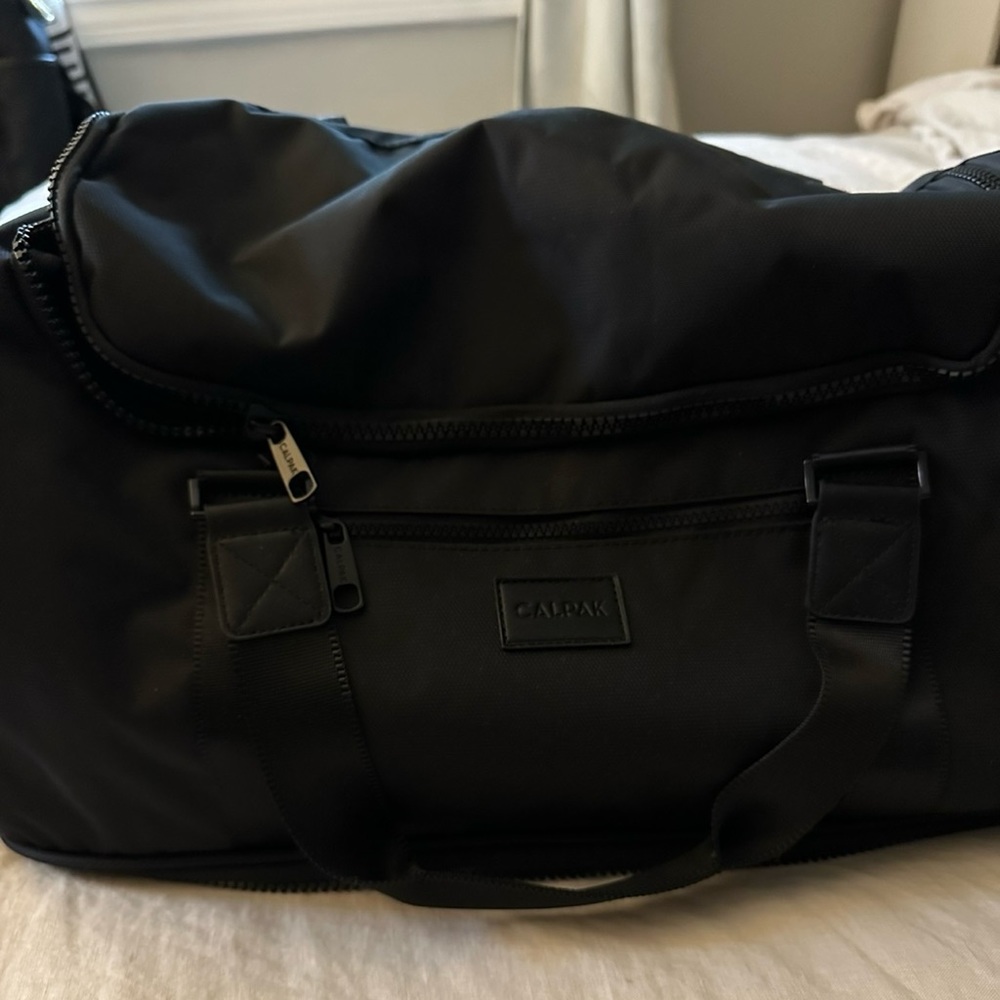 Brand new, never used CalPak Stevyn Duffel with shoe compartment